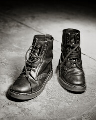 Beautifully aged black leather lace up boots