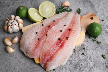 Fresh Seafood Dory Fillet High Protein for Healthy Eating Display with Herbs And Lemon. 