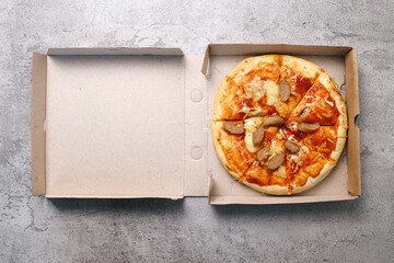Tasty Pepperoni Pizza on Box Isolated on Gray Background 
