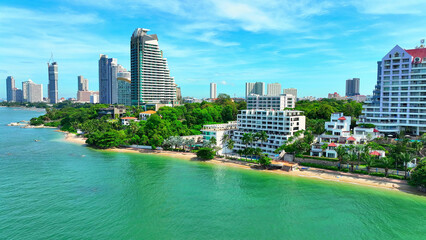 Naklejka premium Experience the thrill of Pattaya Beach, Thailand, as you soar above with a drone. Turquoise waters, an adventurer's dream. Renowned Tropical Paradise: Iconic Seascape. Travel and Tourism concept. 