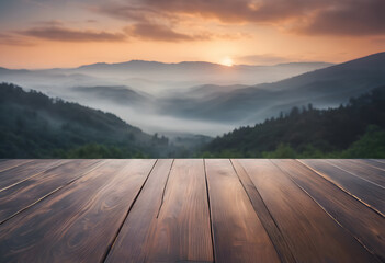 Sunrise over misty mountains with a wooden platform in the foreground, creating a serene and...