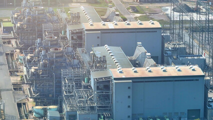 Capturing the majesty of a modern power plant from above, the drone's view reveals an industrial...