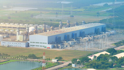 The combined-cycle power plant, viewed from above by a drone, showcases a maze of pipes and...