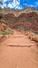 Hiking path along the massiv cliffs seen from Bright Angel hiking trail at South Rim of Grand...