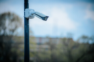 CCTV security camera on blue sky background with copy space for text