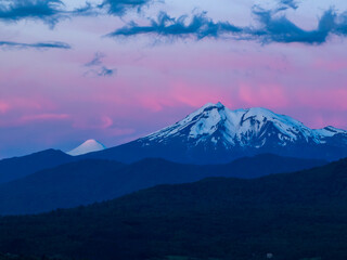 Calbuco volcano and Osorno volcano in the blue hour after sunset. beautiful colored clouds