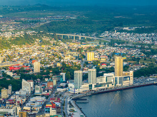 Aerial view of the city of Puerto Montt. The light that passes through the clouds generates spaces...
