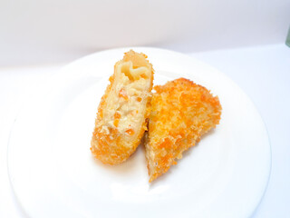 Spicy chicken risoles served on white plate