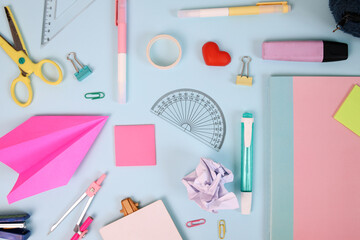 School supplies or stationery on blue background. Back to school concept.