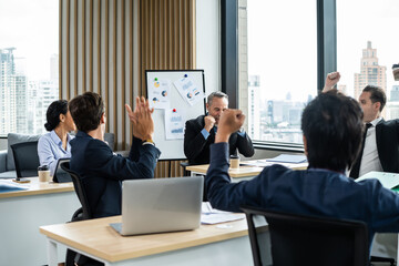 Group of young attractive business people working in office workplace. 