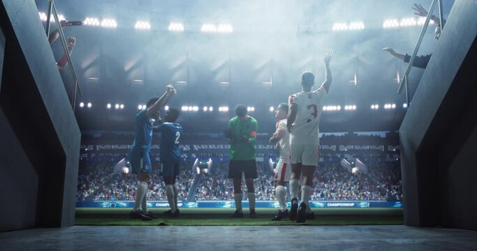 Traditional Soccer Walkout: Portrait of Determined Players Entering the Football Stadium to the Cheers and Support of the Anticipating Loyal Fans. Cinematic Low Angle Back View Footage