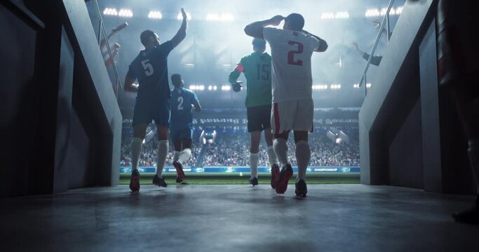Tunnel Walk with Teams of European Football Players Entering a Sold Out Soccer Arena Before a Championship Match. Footballers are Welcomed Like Heroes by International Soccer Fans