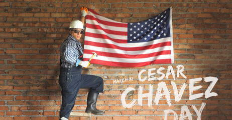 Builder on the brick background. Cesar Chavez day. 31 march, USA national holiday.