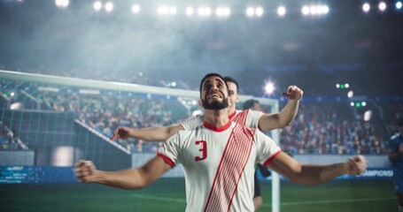 Portrait of a Handsome Multiethnic Soccer Player Celebrating After Scoring a Goal. Caucasian and Middle Eastern Players Hugging Each Other, Excited to Beat the Opponents and Win the Championship Game