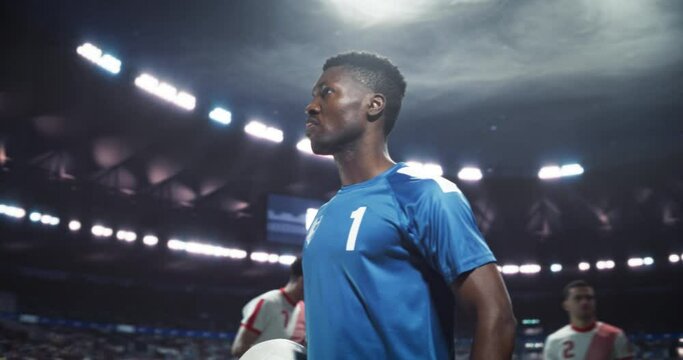 Soccer Players Gathered at the Center of the Field in Crowded Stadium, Preparing for an Important Sports Match. Portrait of an African Team Captain Holding the Ball, Getting Mentally Ready for Battle