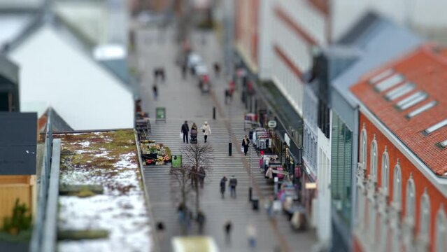 Tilt-Shift Pedestrian Stroll Amidst Busy Street