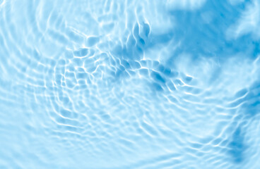 Background summer natural blue texture, clear water with ripples and splashes. Water waves in...
