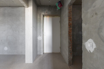 interior of the apartment without decoration in gray colors. rough finish