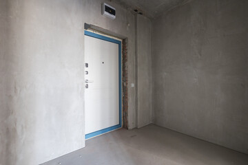 interior of the apartment without decoration in gray colors. rough finish