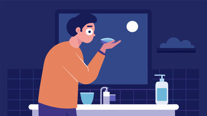 In front of a minimalist bathroom sink a man delicately pats on an eye cream to combat any signs of fatigue from a late night..