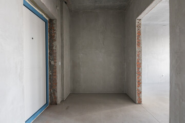 interior of the apartment without decoration in gray colors. rough finish