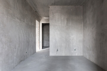 interior of the apartment without decoration in gray colors. rough finish