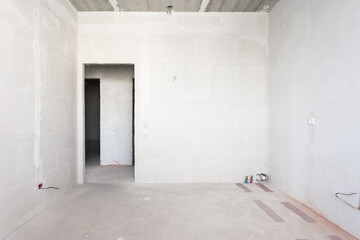 interior of the apartment without decoration in gray colors. rough finish