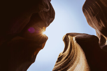 Light shines through ancient sandstone, similar to a canyon in Arizona, background travel concept