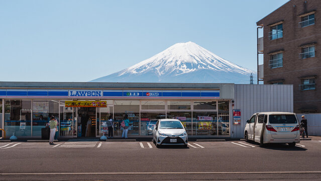Yamanashi, Japan - April 10, 2023 - Lawson Kawaguchiko Station with Mount Fuji in the background.