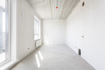 interior of the apartment without decoration in gray colors. rough finish