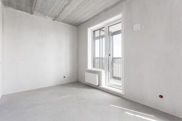 interior of the apartment without decoration in gray colors. rough finish