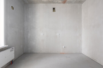 interior of the apartment without decoration in gray colors. rough finish