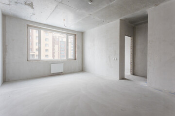 interior of the apartment without decoration in gray colors. rough finish