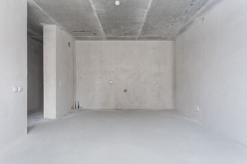 interior of the apartment without decoration in gray colors. rough finish