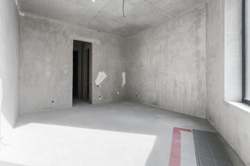 interior of the apartment without decoration in gray colors. rough finish