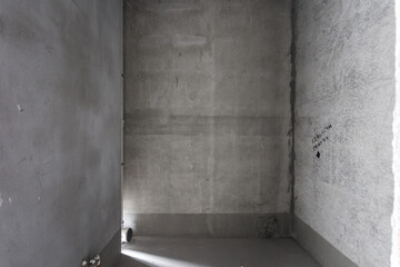 interior of the apartment without decoration in gray colors. rough finish