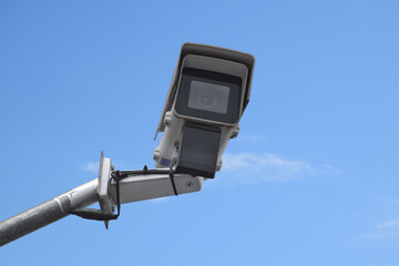 ip cctv camera installed on high metal post against bluesky to do security by monitoring technology...