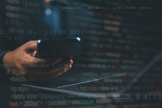 Digital software development, Internet technology concept. Software apps developer, man programmer working on mobile phone and laptop with binary, javascript computer code, big data on virtual screen