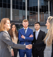 Group of multiracial business people shaking hands for a successful agreement