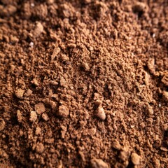 Close-up image of a pile of brown coffee grounds