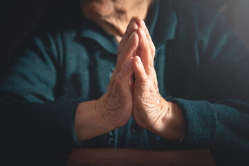 Caucasian elderly woman praying. Faith. Religion