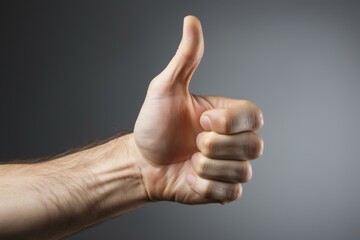 Thumbs up hand sign of a caucasian person