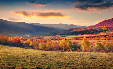 Astonishing autumn sunrise on Carpathian mountains. Colorful morning scene of Borzhava ridge,...