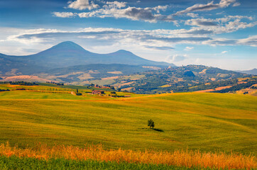 Rural Italian countryside. Stunnig summer view of green pasture in Italy, Europe. Beauty of...