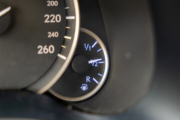 Fuel level on display. Detail from the car cockpit, a symbol of the innovation of auto industry.