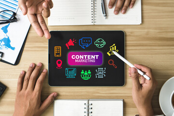 Content marketing concept. Content creators using tablet to consult for Containing seo, content,...