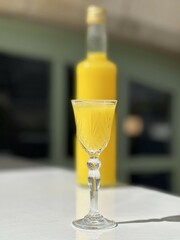 Pouring several glasses of Mexican Mezcal or Tequila shots. Classic Tequila small glasses being served.