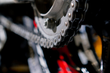 close-up on motorcycle base in a repair shop part of a motorbike with a track for activating the...