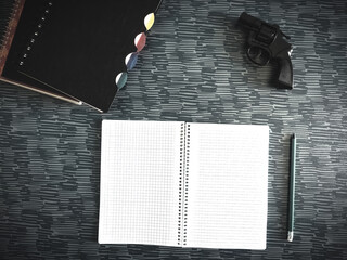 Firearm and Pencil with Textbook Guns in School Utensil Supplies Copy Space