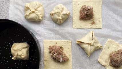 home made,Asian Steamed Bun using ready yeast dough sheet placed in rice cooker tray.